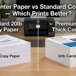 Comparison of thick cardstock and standard copy paper stacks next to a modern office printer.