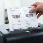 Paper shredder with adhesive residue on cutting blades