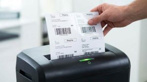 Paper shredder with adhesive residue on cutting blades