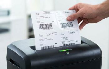 Paper shredder with adhesive residue on cutting blades