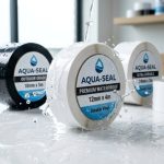 Water droplets splashing on durable waterproof label tape rolls.